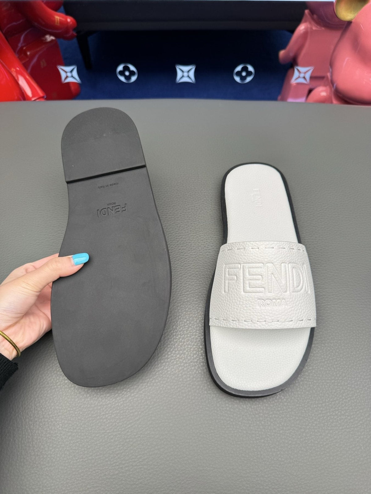 Fendi Embossed Logo Slide Sandals — side