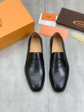 Tod's Black Penny Loafers — hero