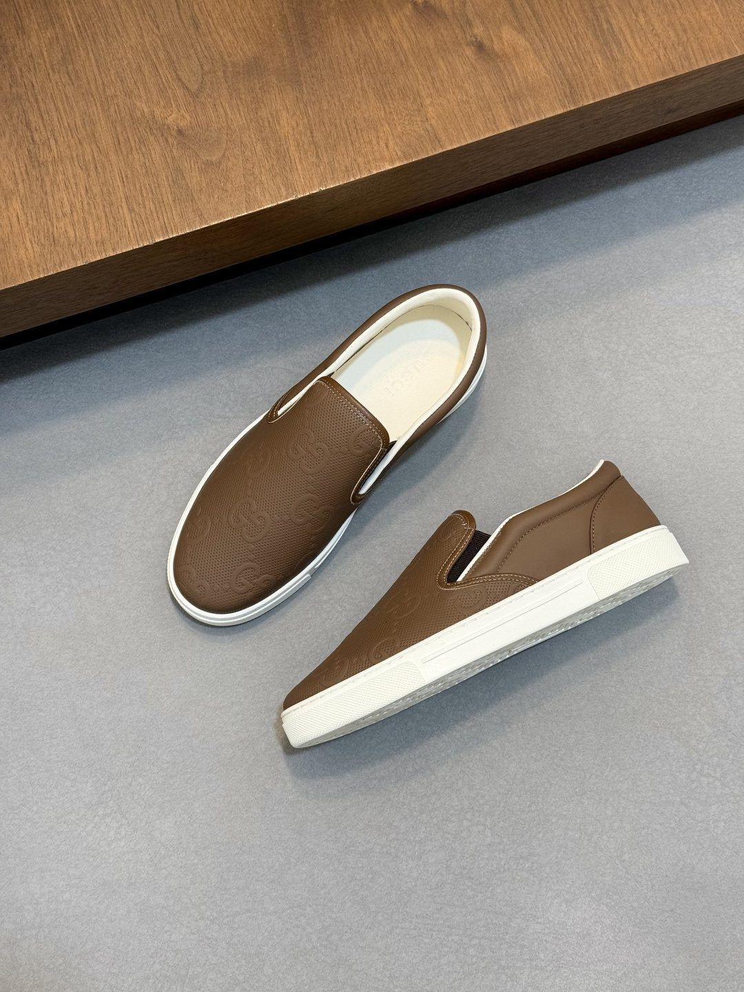 Gucci Embossed Slip-On Sneakers — front